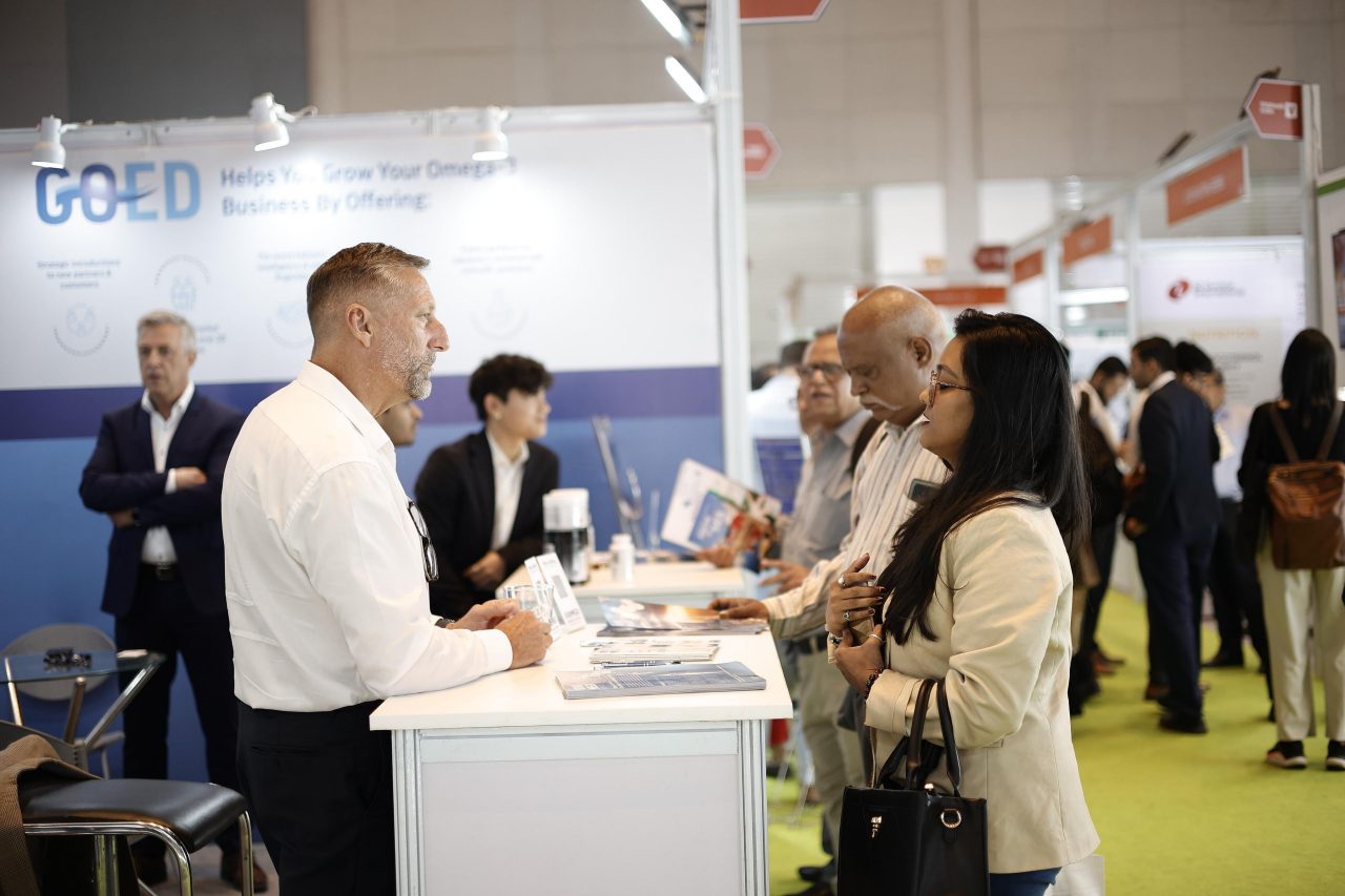 Exhibitor and attendee interacting